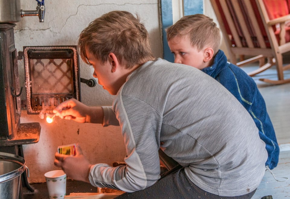 Two children with a matchstick