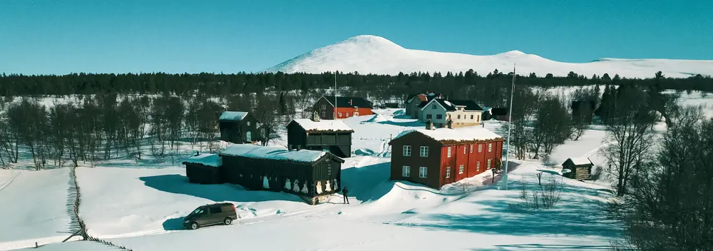  Drone images of the farm yard at Svukuriset, a red and a black cabin.