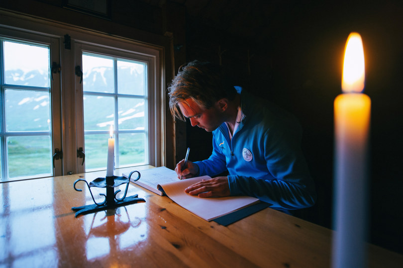 A person writing in a book