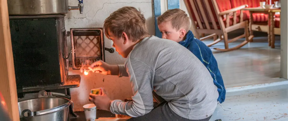 Two children with a matchstick